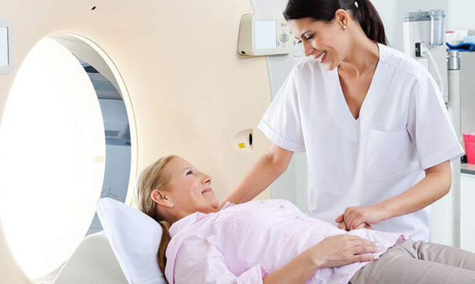 Doctor reviewing annual cancer screening schedule with patient during a preventive health visit