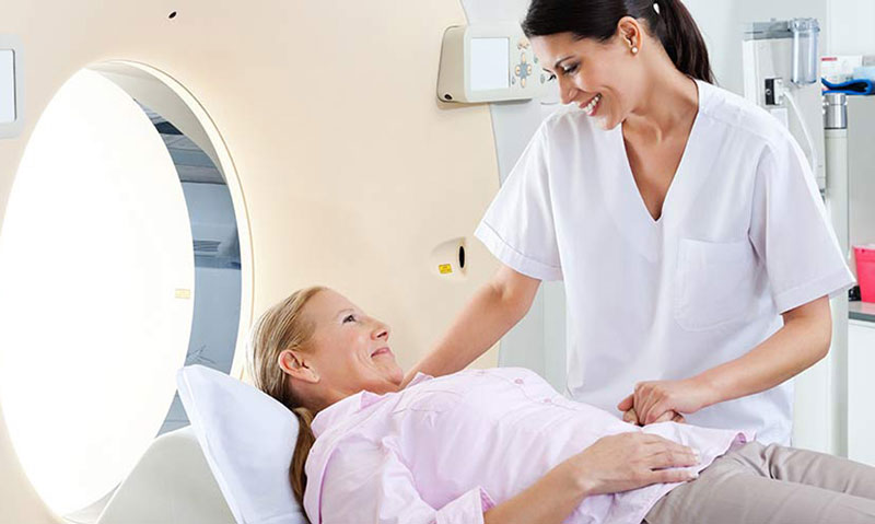 Doctor reviewing annual cancer screening schedule with patient during a preventive health visit