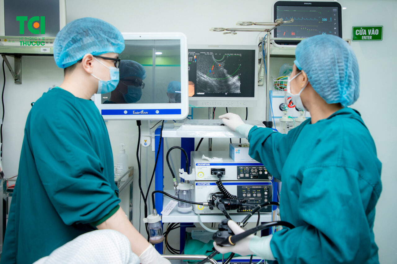 Healthcare provider speaking supportively with a patient in a clinical setting
