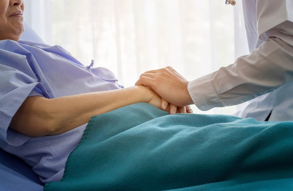 Cancer diagnosis questions being discussed between a patient and oncologist during a hospital consultation