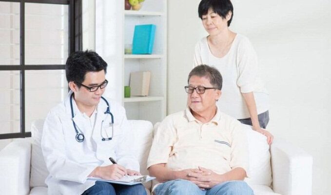Senior adult with healthcare provider discussing cancer screening options, representing cancer screening for seniors