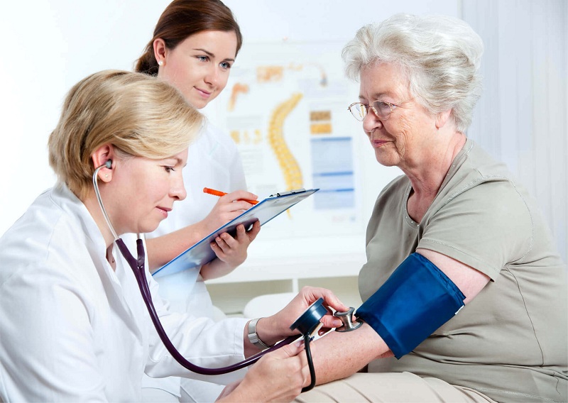 Older adult reviewing Medicare coverage information for cancer screening benefits