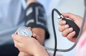 Medical professional using cardiac monitoring equipment to assess heart health as part of a comprehensive cardiovascular evaluation