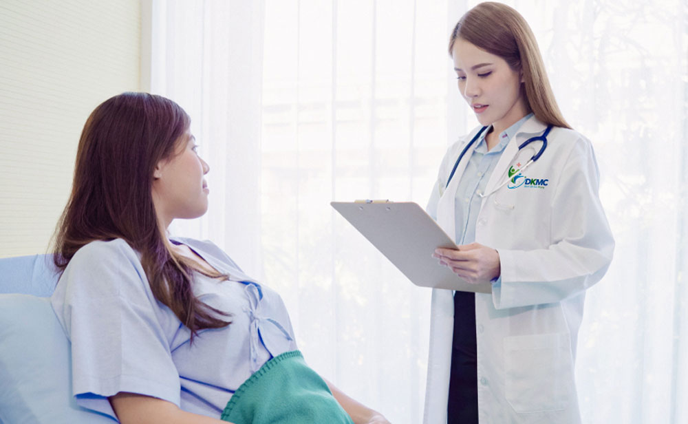 Healthcare professional conducting a preventive cancer screening assessment with a patient at a medical facility