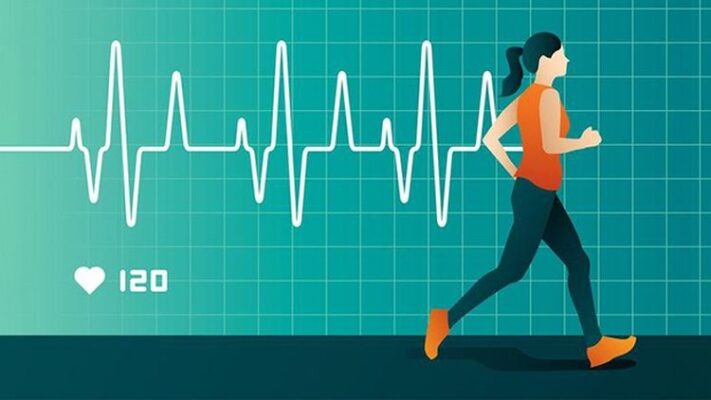 Person checking resting heart rate by measuring pulse at the wrist showing normal cardiovascular health