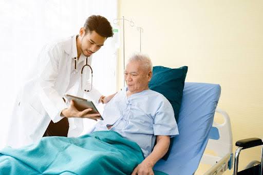 elderly person with diabetes reviewing medications with a pharmacist highlighting polypharmacy risks in older adults