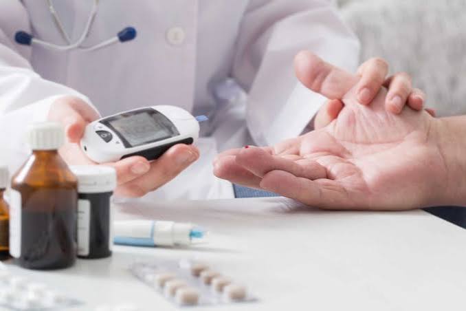 doctor explaining blood pressure targets and medication options to a patient with diabetes and hypertension