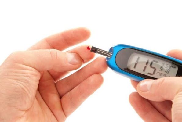 Diabetes checkups what to expect — doctor reviewing blood test results with diabetes patient during routine checkup appointment