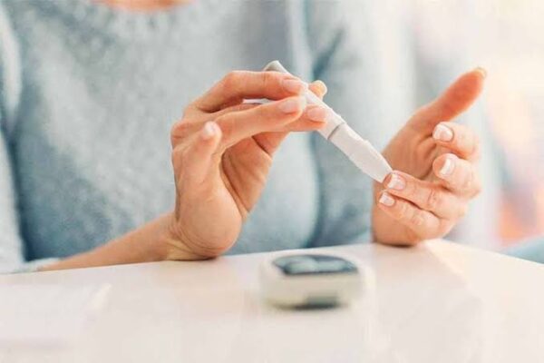 Diabetes medication safety — patient reviewing medication bottles and prescription labels for safe diabetes drug management