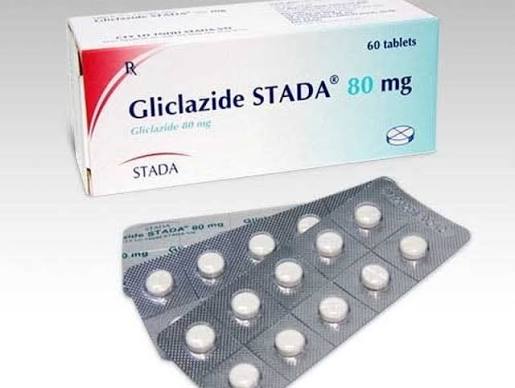 Hypoglycemia symptoms and treatment — person experiencing low blood sugar symptoms with glucose tablets and juice as fast-acting carbohydrate treatment