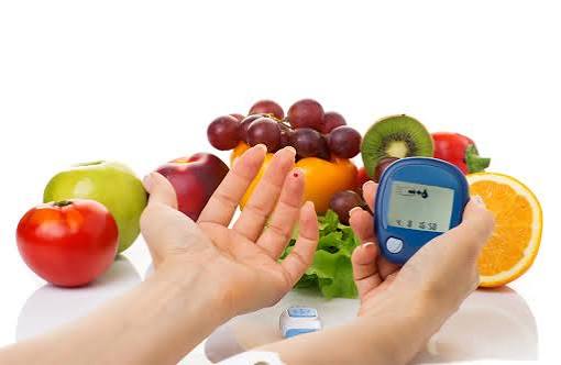 fruits and diabetes — variety of fresh whole fruits including berries, apples, and citrus for blood sugar management