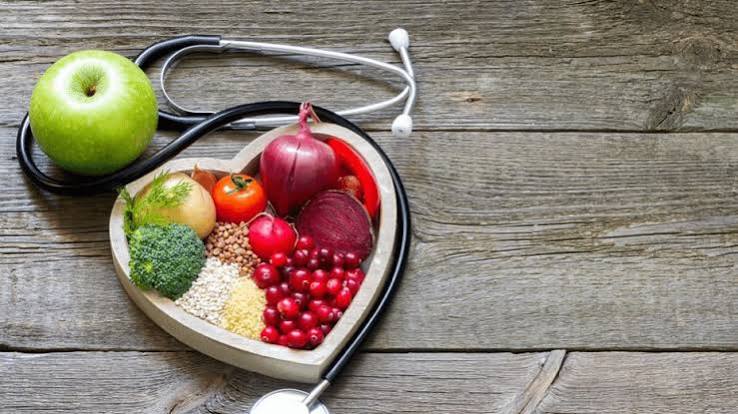 Heart disease prevention for men — man at routine cardiovascular health checkup measuring blood pressure