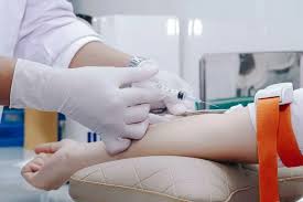 Doctor reviewing cholesterol test results with a patient to determine how often cholesterol should be checked