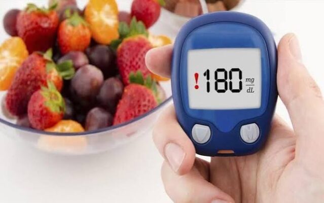 low-glycemic foods — lentils, sweet potato, oats, and berries arranged on a table showing GI scores