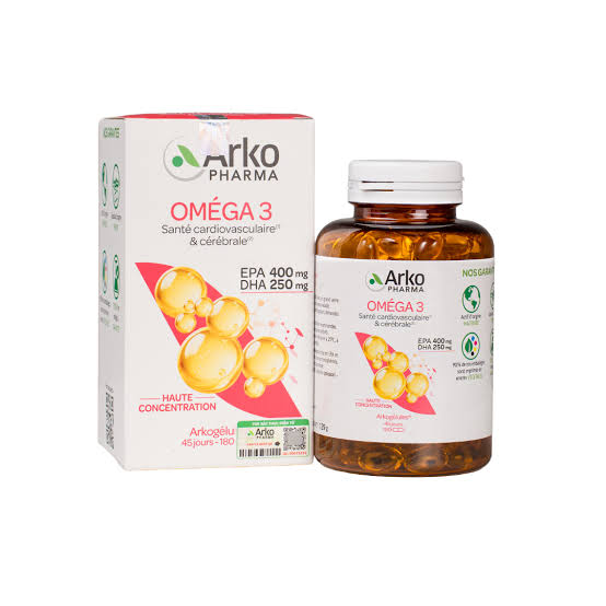 Omega-3 fish oil supplements and krill oil capsules next to a piece of salmon