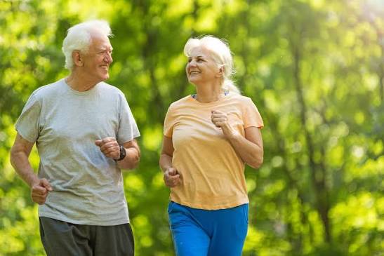person celebrating healthy blood glucose reading after prediabetes reversal through lifestyle changes including diet and exercise