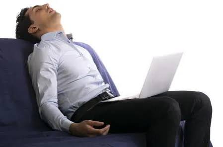 person sitting at a desk for long hours illustrating sedentary behavior that increases diabetes and metabolic disease risk