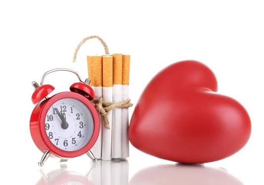 Person breaking cigarette representing smoking cessation and heart disease risk reduction timeline