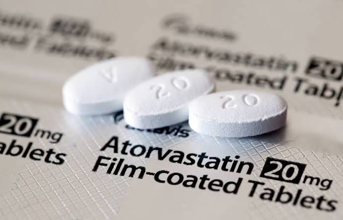 Doctor discussing statins and cholesterol medication with a patient in a clinical setting