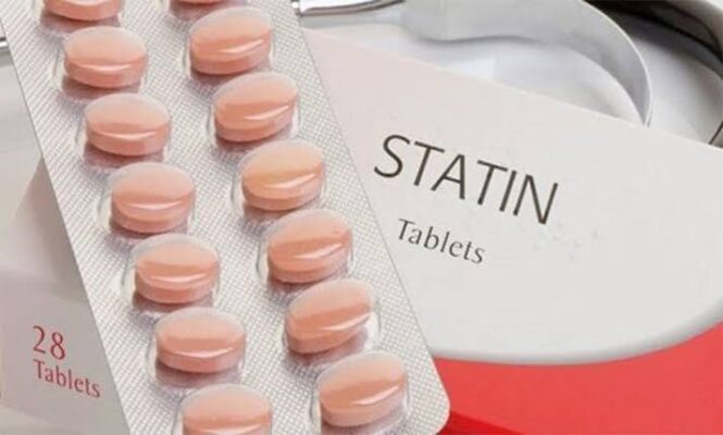 Statins what adults should know — statin medication tablets next to a cholesterol test result