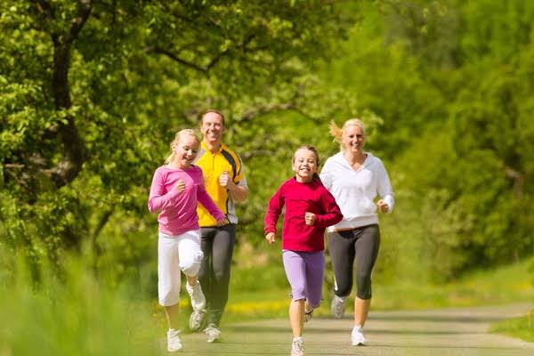 person doing brisk walk outdoors to lower blood sugar and improve glucose control naturally