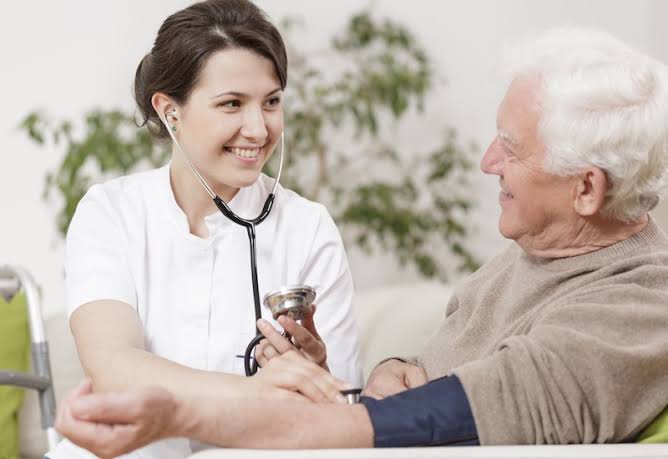 older adult discussing heart symptoms with cardiologist during evaluation
