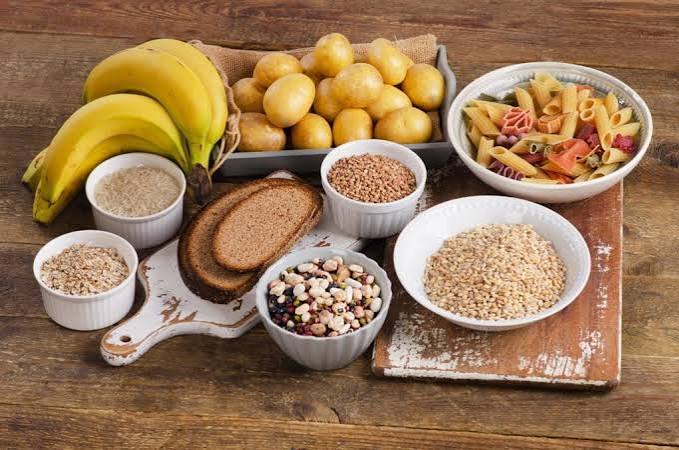 Safe foods for diarrhea recovery including bananas, white rice, toast, applesauce and oral rehydration solution
