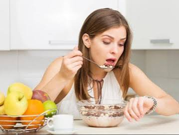 Person eating slowly and mindfully, enjoying a meal with time for proper chewing and digestion