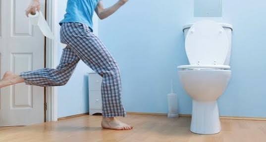 frequent nighttime urination — adult person awake at night experiencing nocturia illustrating the sleep disruption caused by repeated bathroom trips
