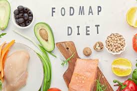 Low-FODMAP foods for IBS including rice, oats, carrots, eggs, lean meat and lactose-free dairy alongside high-FODMAP foods to avoid including wheat, garlic, onion, apples and legumes