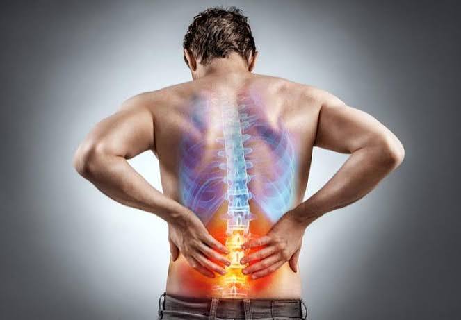 kidney stone pain what it feels like — person in severe flank pain from renal colic showing typical posture of restlessness and inability to find comfort
