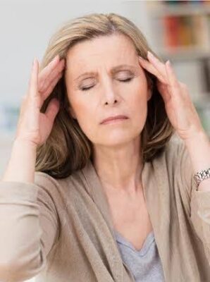 Menopause and urinary symptoms — middle-aged woman experiencing urgency and discomfort from genitourinary syndrome of menopause illustrating how estrogen decline affects bladder function