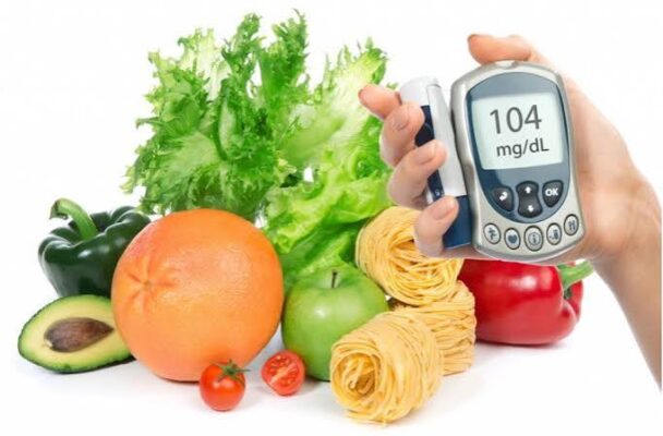 supplements for blood sugar — bottles of common supplements on a table with a glucose meter