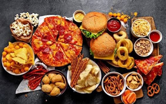 Ultra-processed food products including packaged snacks, instant noodles, and processed meats that disrupt gut microbiome and digestive health