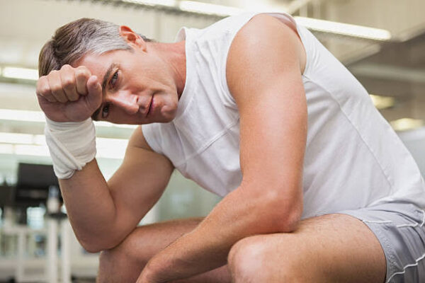 Urinary health for men after 50 — older man discussing lower urinary tract symptoms with urologist to evaluate BPH, overactive bladder, and other causes of voiding difficulty