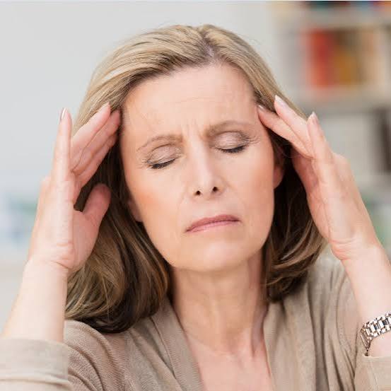 Urinary health for women after 50 — postmenopausal woman discussing bladder symptoms with gynecologist covering stress incontinence, overactive bladder, and UTI prevention
