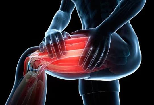 Muscle stiffness causes and prevention — person stretching tight muscles after exercise suggesting DOMS or deconditioning