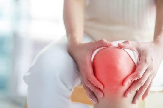 Joint redness and warmth — red inflamed knee or toe showing classic signs of acute gout septic arthritis or inflammatory arthritis