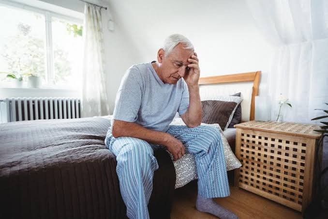 Muscle weakness possible causes — person experiencing proximal muscle weakness difficulty rising from chair or climbing stairs