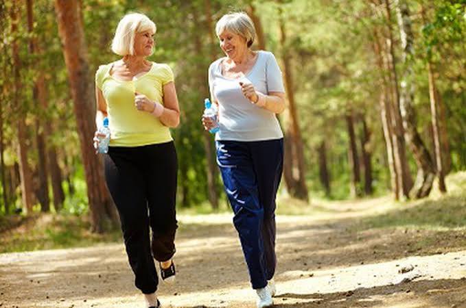Mobility and healthy aging — older adult walking outdoors demonstrating active mobility balance and functional independence