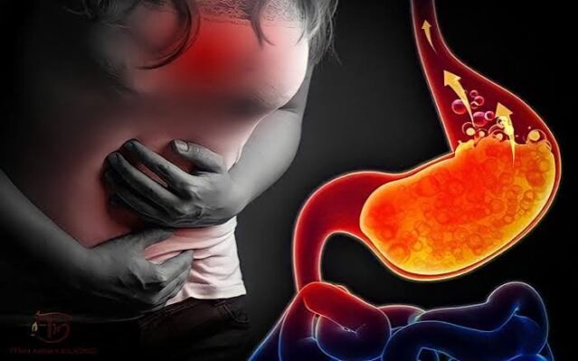 Person sleeping on left side in elevated position to reduce posture and acid reflux symptoms and nocturnal GERD at night