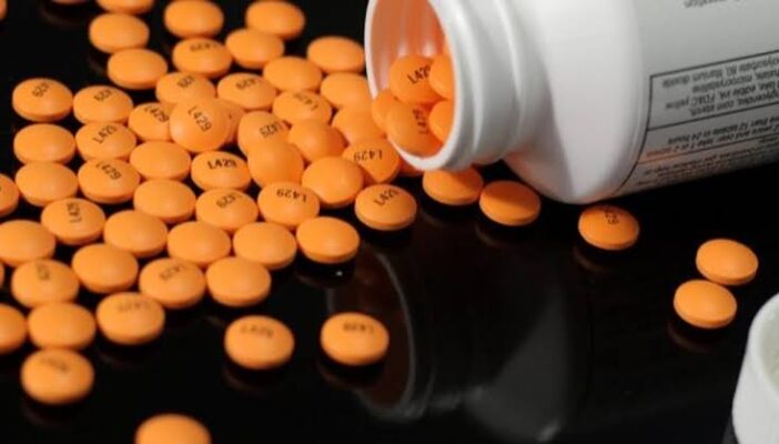 Proton pump inhibitor medication capsules including omeprazole and esomeprazole with blister packaging showing common PPI drugs prescribed for GERD and acid reflux
